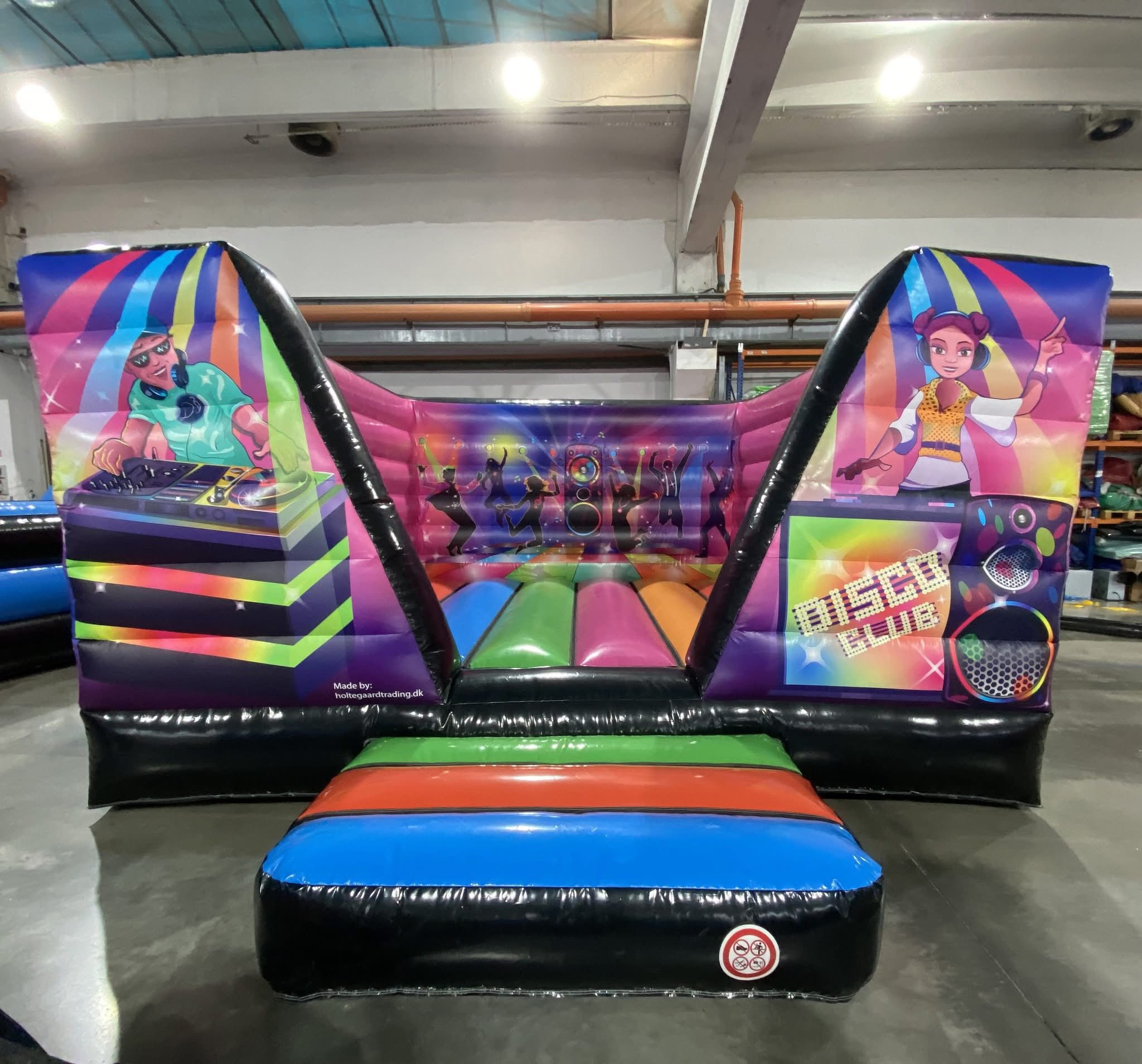 Eight shirts arranged on table in black, olive, grey, blue, white, red, mustard, and green.