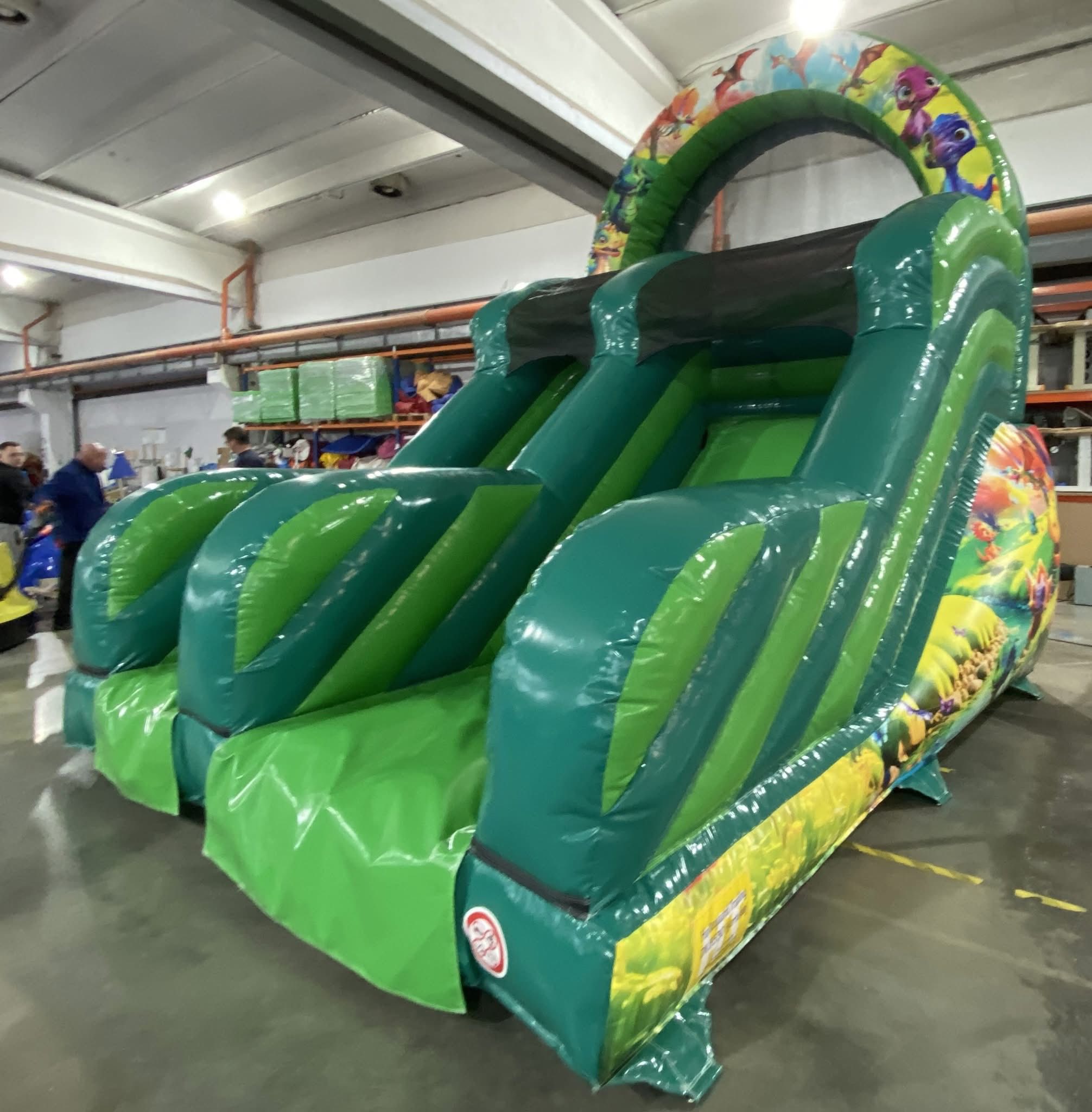 Eight shirts arranged on table in black, olive, grey, blue, white, red, mustard, and green.