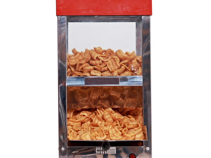 Eight shirts arranged on table in black, olive, grey, blue, white, red, mustard, and green.