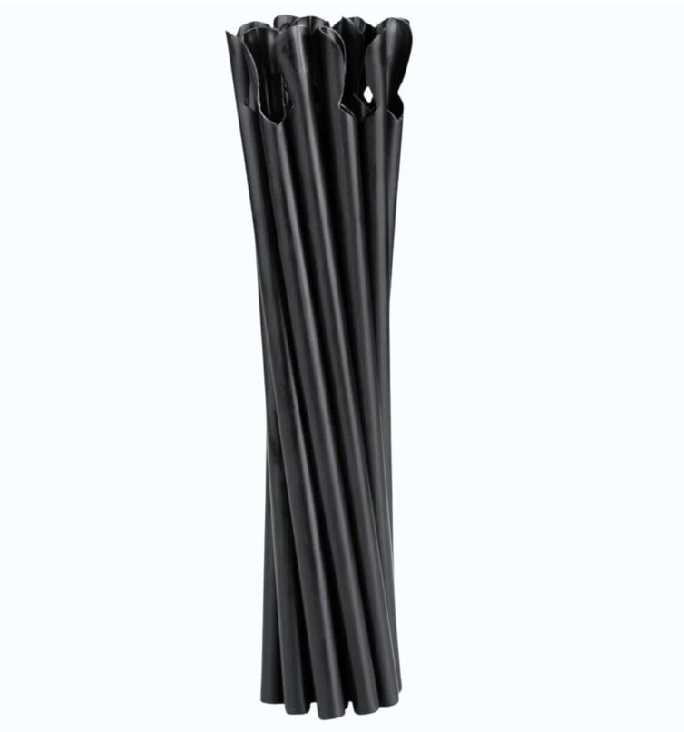 Eight shirts arranged on table in black, olive, grey, blue, white, red, mustard, and green.