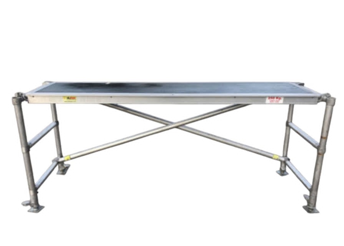 Eight shirts arranged on table in black, olive, grey, blue, white, red, mustard, and green.