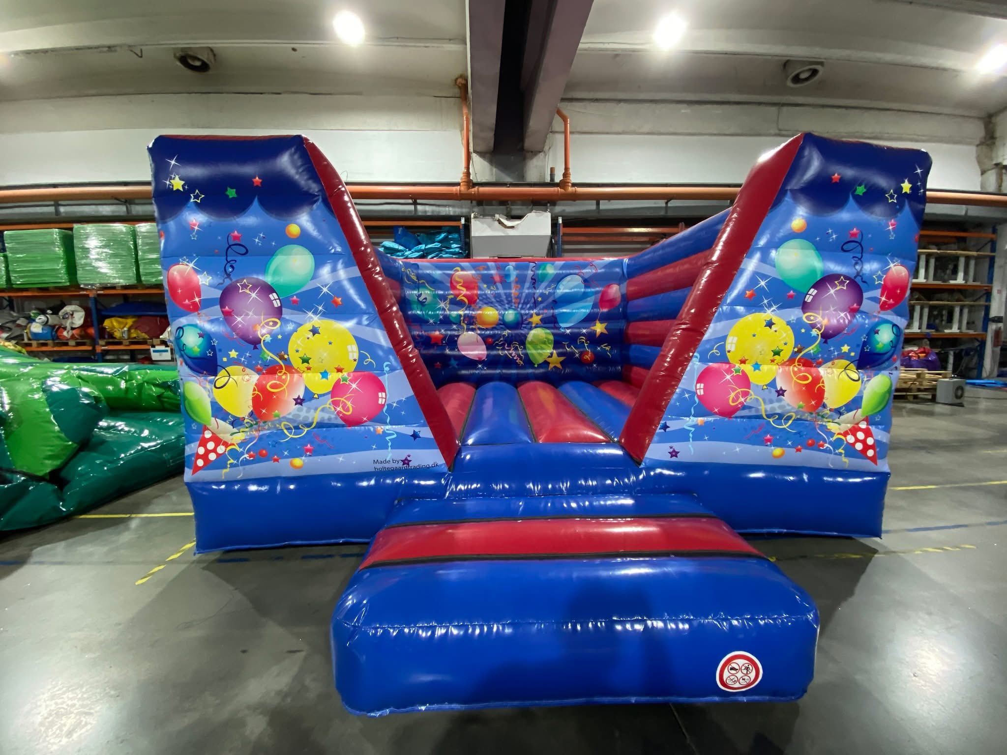 Eight shirts arranged on table in black, olive, grey, blue, white, red, mustard, and green.