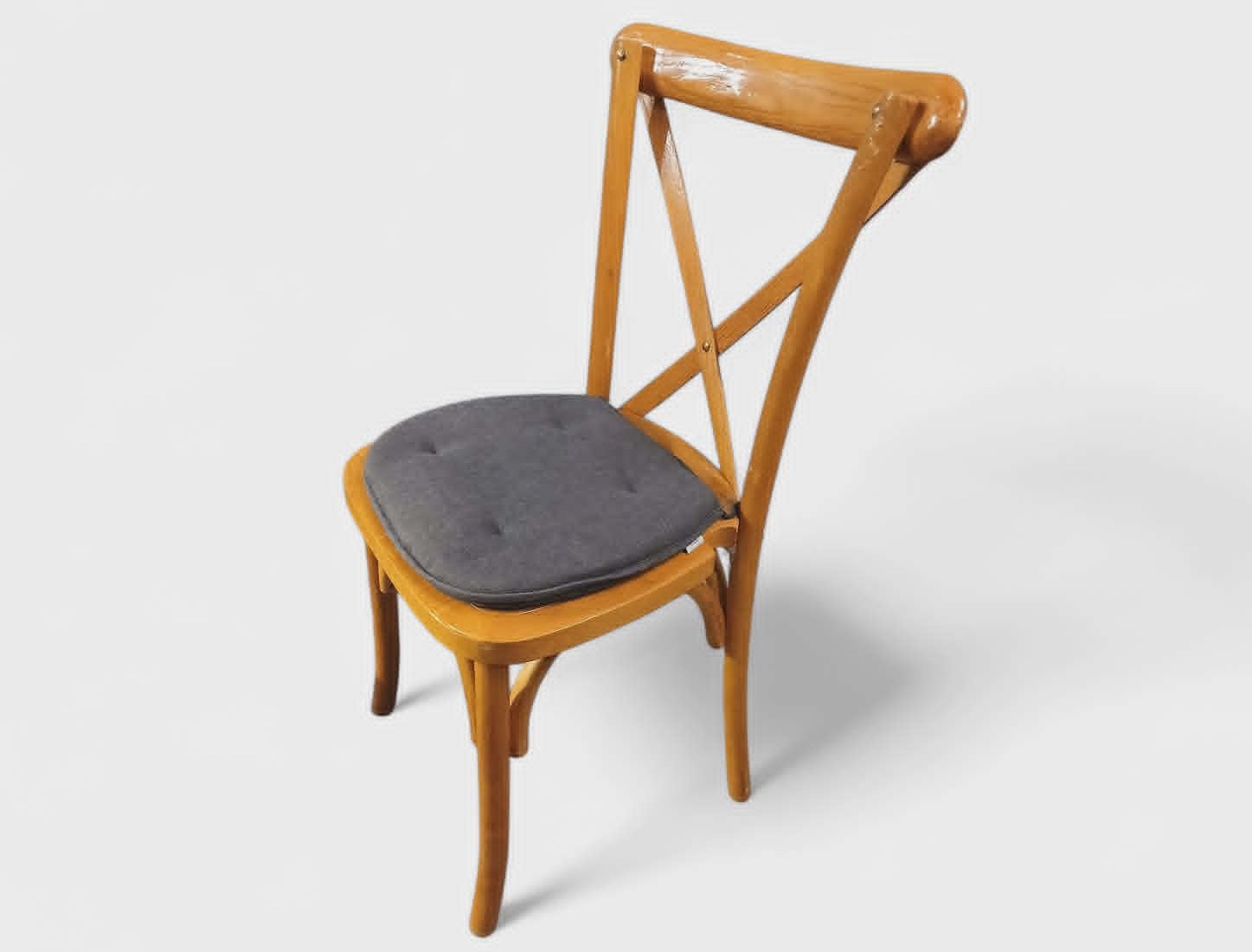 Eight shirts arranged on table in black, olive, grey, blue, white, red, mustard, and green.