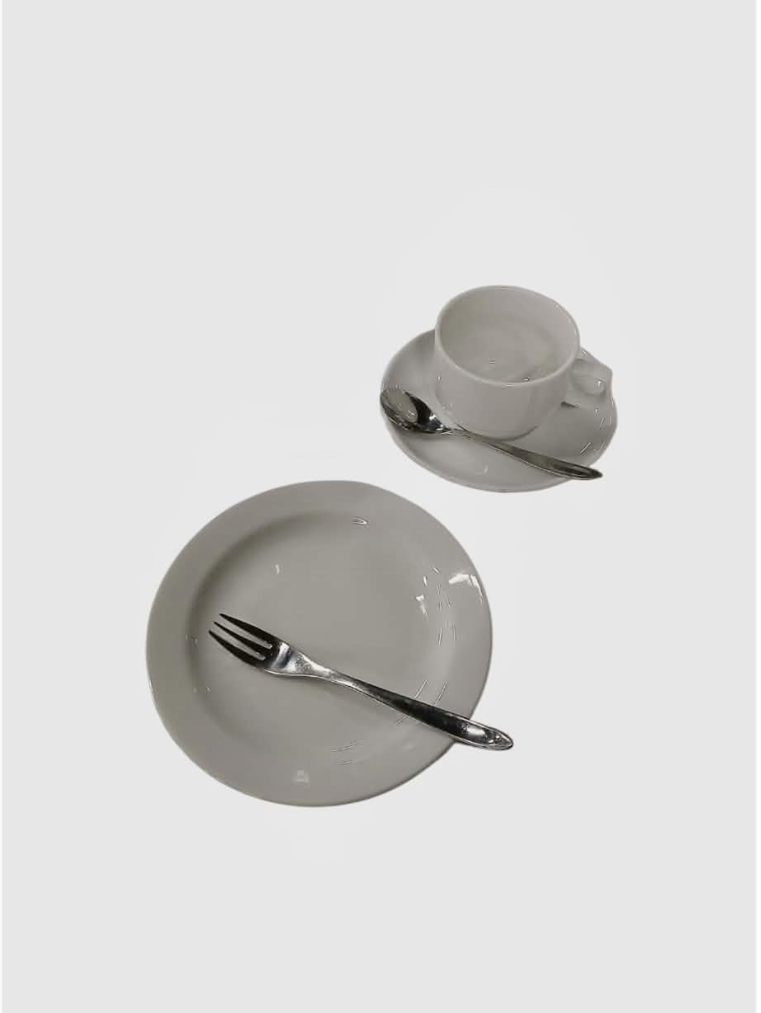 Eight shirts arranged on table in black, olive, grey, blue, white, red, mustard, and green.