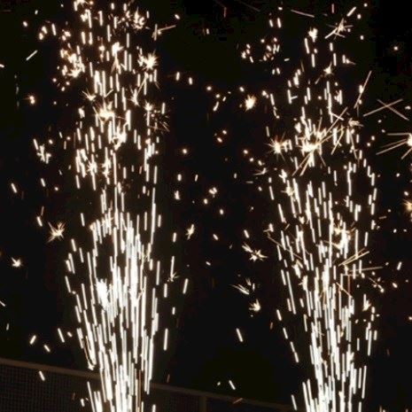 Eight shirts arranged on table in black, olive, grey, blue, white, red, mustard, and green.